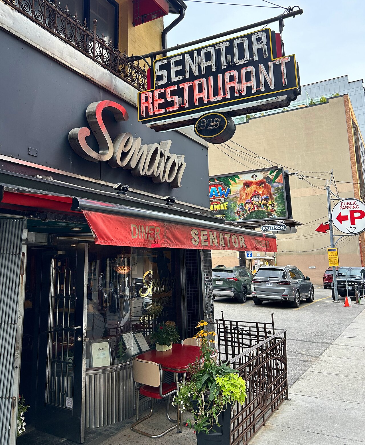 Illuminated storefront lettering and neon sign